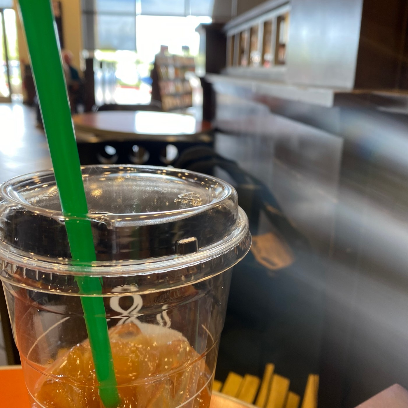 A coffee cup inside a bookstore