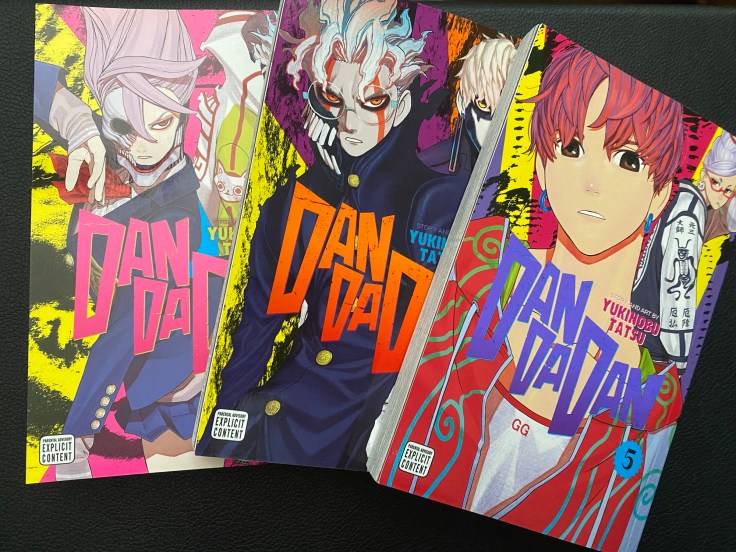 The covers to Dandadan volumes 5, 6, and 7
