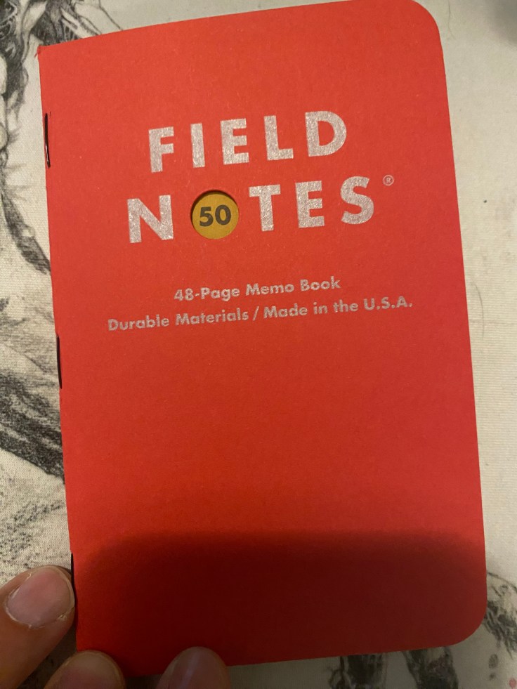 The cover of a red Field Notes 50 pocket notebook.