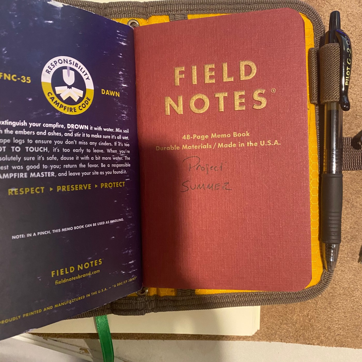 A Field Notes notebook with the words Project SUMMER written on the cover.